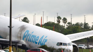 The Amazon cargo jet slammed into the van on airport property (David Santiago/AP)