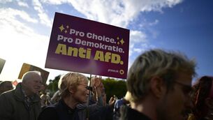<p>People protest and hold a placard reading "For choice, for democracy, against AfD" during a rally following a landmark election in the fderal state of Saxony-Anhalt. Photo: John MacDougall/ AFP via Getty Images </p>