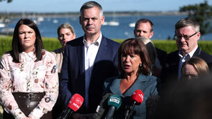 <p>Sinn Féin leader Mary Lou McDonald, with TD Pearse Doherty speaking at the Sinn Féin think-in in Malahide, Co Dublin (Clodagh Kilcoyne/PA)</p>