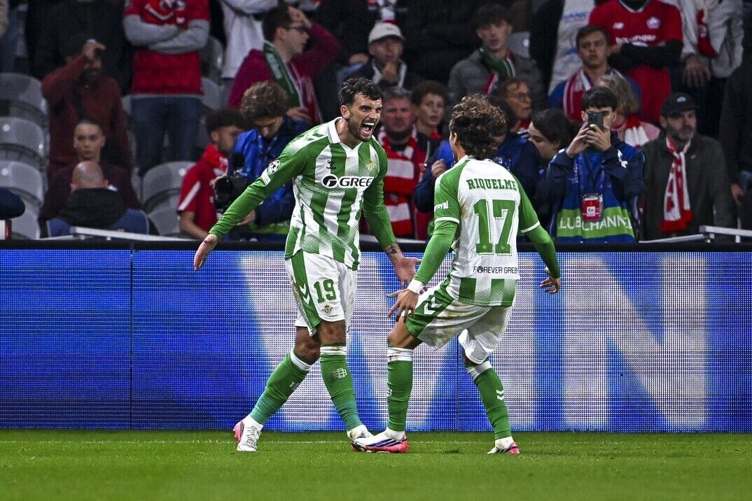 Troy Parrott of Real Betis celebrates with teammate Rodrigo Riquelme. Pic: Baptiste Fernandez/Sportsfile