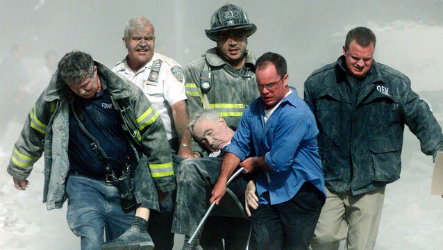 <p>The lifeless body of FDNY chaplain Fr Mychal Judge is borne from the World Trade Center North Tower by firefighters Christian Waugh and Zachary Vause; NYPD Lt William Cosgrove; civilian John Maguire, and FDNY EMT Kevin Allen on September 11, 2001. Picture: Shannon Stapleton/Reuters</p>
