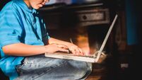 A child using a laptop.