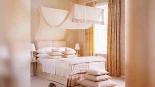 <p>A very clever nod to a conventional canopy created with two rods, a little wire and a sheer panel. For a contemporary look, concentrate the drapery at the head end of the bed. Picture: iStock</p>
