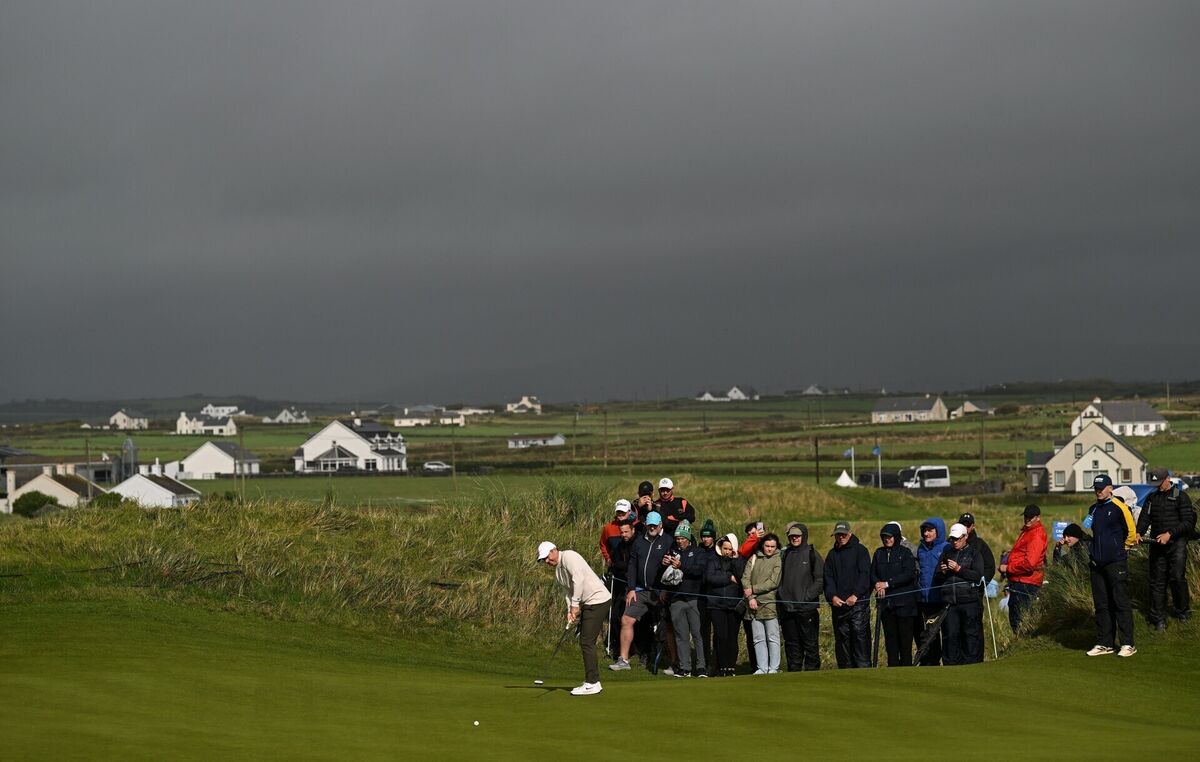 BLACK DAY: Rory McIlroy putts on the sixth green during day one of the Amgen Irish Open Golf Championship at Trump International Golf Links in Doonbeg. Pic: Ramsey Cardy/Sportsfile BLACK DAY: Rory McIlroy putts on the sixth green during day one of the Amgen Irish Open Golf Championship at Trump International Golf Links in Doonbeg. Pic: Ramsey Cardy/Sportsfile