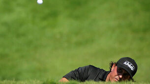 Rory McIlroy and pack pick up shots to put pressure on Aussie pair