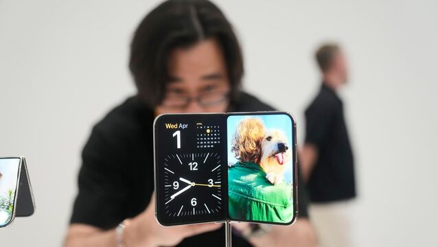 <p>The iPhone Duo is displayed on Wednesday on the Apple campus in Cupertino. (AP Photo/Jeff Chiu)</p>