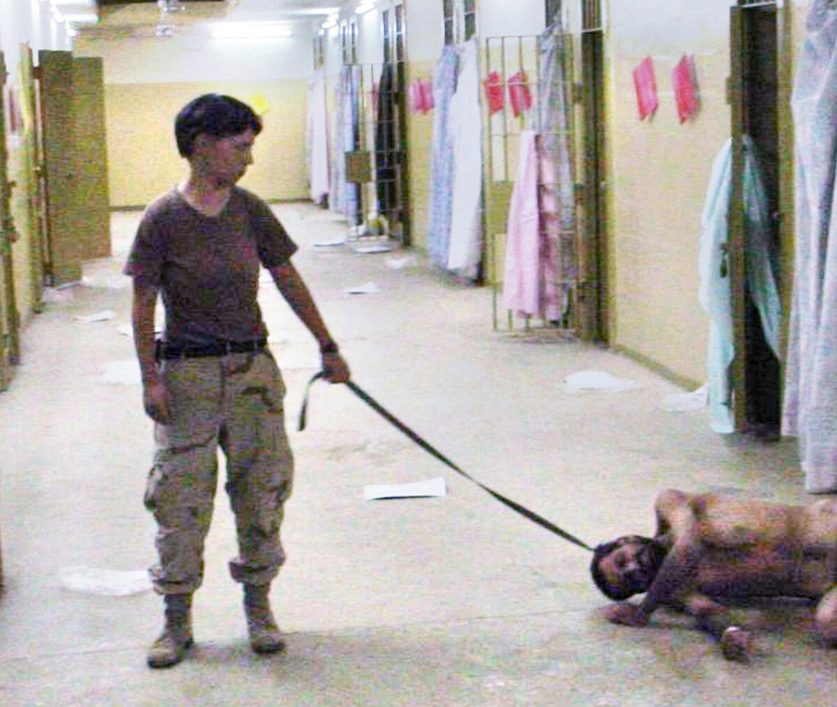US Army solider Lynndie England of the 372nd Military Police Company with a naked detainee on a leash at the Abu Ghraib prison in Baghdad. Picture: The Washington Post/AP