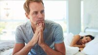 Man, thinking and married in bedroom at house with stress, anxiety and problem of secret from cheating on sleeping woman. Frustr