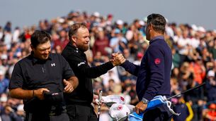 <p>Shane Lowry shakes hands with Pádraig Harrington after finishing his second round at the Irish Open. Pic: ©INPHO/Ben Brady</p>