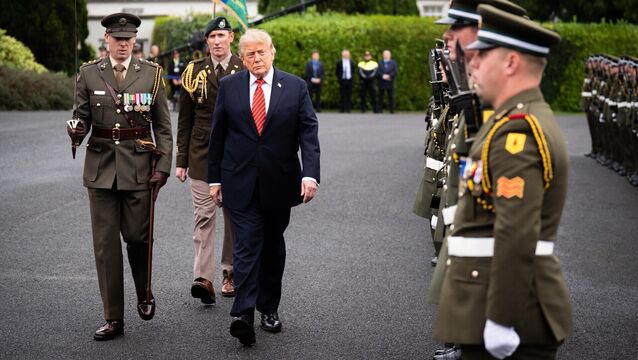 <p>US president Donald Trump views the guard of honour outside Aras an Uachtarain, ahead of his meeting with President Catherine Connolly. Picture: James Manning/PA Wire</p>