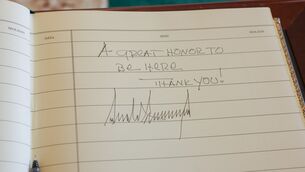 <p>A message left by US President Donald Trump in the visitors' book at Áras an Uachtaráin. Picture: Tony Maxwell/Maxwells/PA Wire</p>