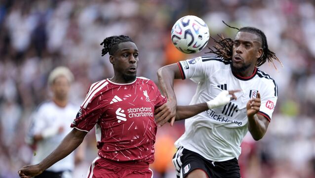 <p>Liverpool's Jeremie Frimpong and Fulham's Alex Iwobi battle for the ball. Pic: Peter Byrne/PA Wire.</p>