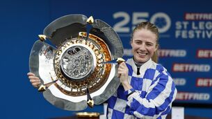 <p>Saffie Osborne lifts the trophy after winning the Betfred St Leger Stakes at Doncaster.</p> <p>Saffie Osborne lifts the trophy after winning the Betfred St Leger Stakes at Doncaster.</p>