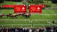 Shane Foley (pink silks) onboard Hotazhell comes home to win ahead of Christophe Soumillon (red silks) onboard Wimbledon Hawkeye