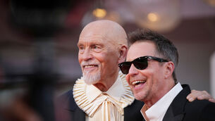 John Malkovich and Sam Rockwell pose for photographers on the red carpet in Venice earlier in September (Alessandra Tarantino/Invision/AP)