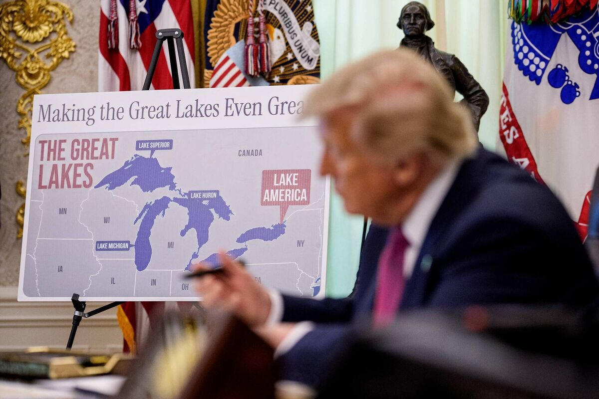A map labeling Lake Ontario as "Lake America" is displayed as US president Donald Trump signs an executive order during an event in the Oval Office of the White House last month. Picture: Andrew Harnik/Getty Images