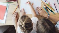 Homeschooling: Hands of an Unrecognizable Child Drawing While Sitting on her Mother's Lap, Lockdown Activities Concept (Overhead