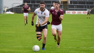 <p> Clyda Rovers’ Gary Deane and Bishopstown’s Kieran McFadden battle for possession in what was essentially a relegation play off duel at Pairc Ui Rinn on Sunday. Pic: Noel Sweeney</p>