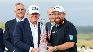 <p>US president Donald Trump presents Shane Lowry with the Irish Open trophy. Picture: INPHO/Dan Clohessy</p>