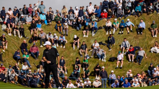 <p>Shane Lowry reads the green ahead of his birdie putt on the seventh green. Pic: Mandatory Credit ©INPHO/Ben Brady</p>