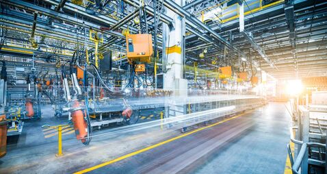 robots welding in a car factory