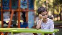 Sad kid on the playground