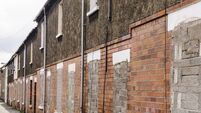 Blocked up terraced houses ready for demolition.