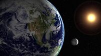 Sun, moon, earth and starfield
