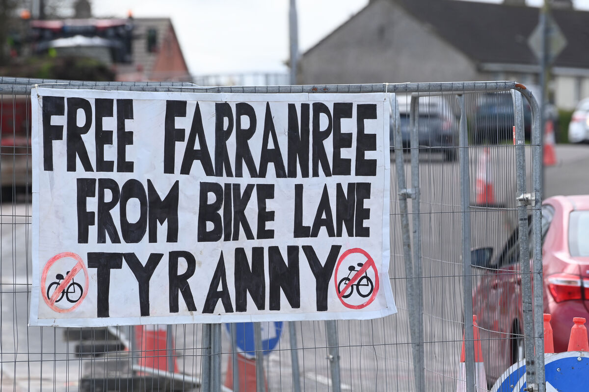'Free Farranree from Bike Lane Tyranny' signage erected on the fencing at Knockpogue Avenue, Farranree as residents continue their campaign against the removal of tree and parking spaces to facilitate the construction of bike lanes in the northside community. Picture: Larry Cummins 'Free Farranree from Bike Lane Tyranny' signage erected on the fencing at Knockpogue Avenue, Farranree as residents continue their campaign against the removal of tree and parking spaces to facilitate the construction of bike lanes in the northside community. Picture: Larry Cummins