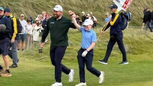 <p>Athenry's Cillian Hirst with newly minted Amgen Irish Open champion Shane Lowry at Doonbeg.</p>