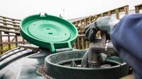 Heating oil delivery, nozzle placed into oil tank to refill