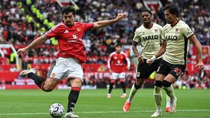 <p>Harry Maguire handled the ball and then scored via a deflection against Ipswich, meaning his goal stood. Pic: Paul ELLIS / AFP via Getty Images</p>