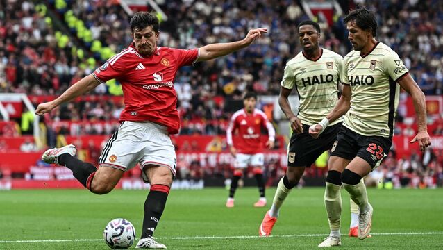 <p>Harry Maguire handled the ball and then scored via a deflection against Ipswich, meaning his goal stood. Pic: Paul ELLIS / AFP via Getty Images</p>