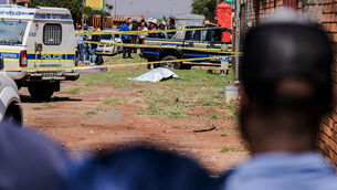 A body is found along a road in KwaThema (AP) A body is found along a road in KwaThema (AP)