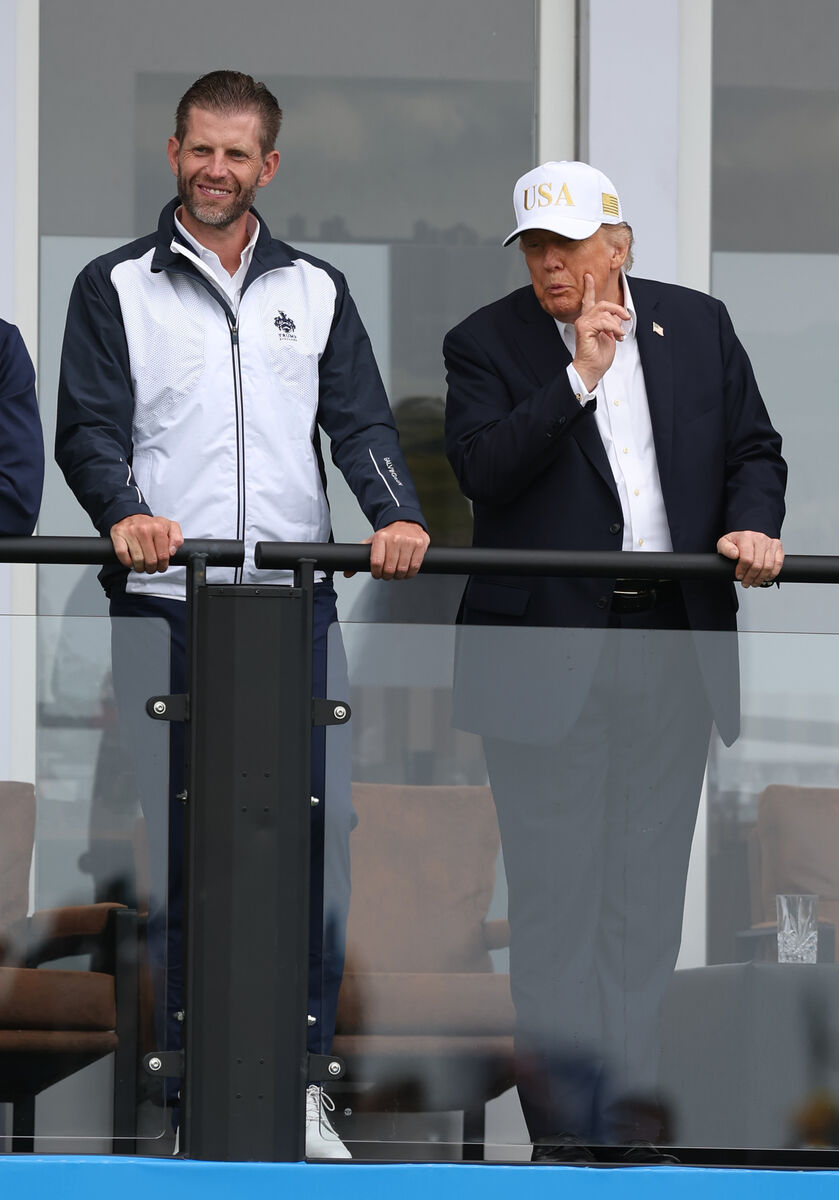 Donald Trump and his son Eric watch the golf last weekend. Donald Trump and his son Eric watch the golf last weekend.