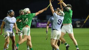 <p class="contextmenu internal_Caption">JJ Carey of Na Piarsaigh in possession despite the attentions of Luke O’Connor, Ballybrown. Pic: Brendan Gleeson</p>