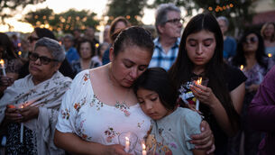 Judith Cabrera and her daughter, April, attend a vigil for the victims of a fatal SUV-Metro bus collision and the subsequent crash of a TV news helicopter covering it in the Chatsworth area of Los Angeles (AP) Judith Cabrera and her daughter, April, attend a vigil for the victims of a fatal SUV-Metro bus collision and the subsequent crash of a TV news helicopter covering it in the Chatsworth area of Los Angeles (AP)