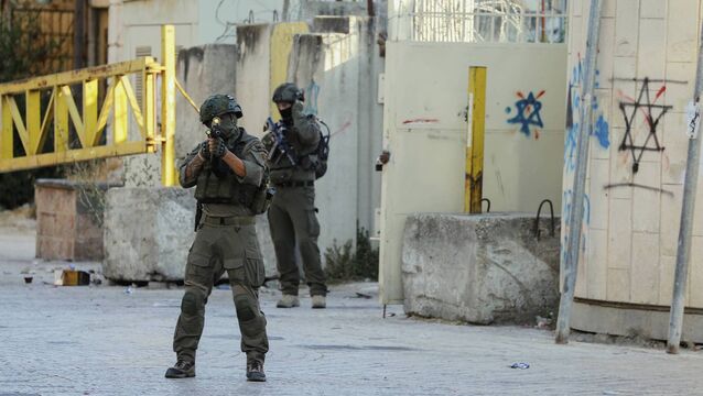 <p>Israeli military forces conducting a raid on June 28, 2025, in the centre of Hebron in the occupied West Bank, forcing Palestinian shop owners to close their shops and expel them from the area. Picture: Mosab Shawer/Middle East Images/AFP/Getty</p>
