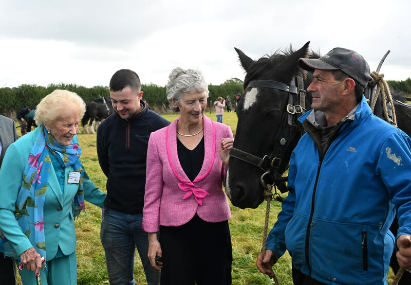 The legendary National Ploughing Association chief Anna May McHugh with President Catherine Connolly and competitor Killian Lydon and his father Brendan Lydon during the 2026 ploughing championships. Picture: Larry Cummins