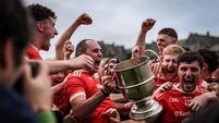 Rathmore players celebrate with the trophy after the final whistle led by Dan Murphy 20/9/2026