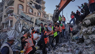 <p>Palestinian civil defence crews carrying a body from the rubble of a collapsed building in Gaza last Wednesday. It had housed displaced Palestinians but was damaged by recent Israeli missile attacks. Picture: Jehad Alshrafi/AP</p> <p>Palestinian civil defence crews carrying a body from the rubble of a collapsed building in Gaza last Wednesday. It had housed displaced Palestinians but was damaged by recent Israeli missile attacks. Picture: Jehad Alshrafi/AP</p>