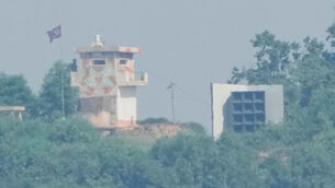 <p>A North Korean military guard post, left, and loudspeaker are seen from Paju, South Korea, near the border with North Korea. Picture: AP Photo/Ahn Young-joon, File.</p> <p>A North Korean military guard post, left, and loudspeaker are seen from Paju, South Korea, near the border with North Korea. Picture: AP Photo/Ahn Young-joon, File.</p>
