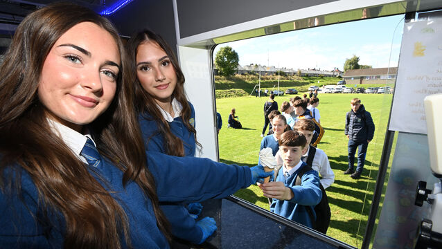 <p>Vanessa Hurley and Alyssa Nagi serving students at Coláiste Eamonn Rís with the ice-cream van,  which was generously donated by Ó ’Crualaoí Butchers. Picture: Eddie O'Hare</p>