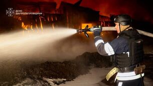 A rescue worker puts out a fire at an infrastructure facility damaged in a Russian strike on Dnipropetrovsk region, Ukraine (Ukrainian Emergency Service via AP) A rescue worker puts out a fire at an infrastructure facility damaged in a Russian strike on Dnipropetrovsk region, Ukraine (Ukrainian Emergency Service via AP)