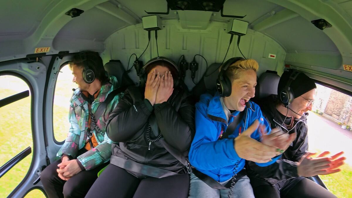 Three delighted players and one who's definitely not loving the helicopter ride. Pictures: Evan Doherty