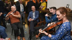 <p>Taoiseach Michael Martin listening to performers at Fleadh Cheoil na hEireann 2026, in Belfast. Picture: Mark Marlow/PA Wire</p>