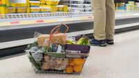 Shoppers at supermarket Sainsbury's for their weekly shopping when special prices are on offer, dealing with the cost of living