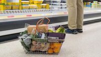 Shoppers at supermarket Sainsbury's for their weekly shopping when special prices are on offer, dealing with the cost of living
