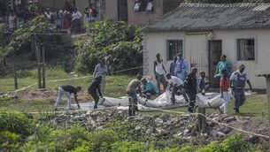 <p>South African forensic pathology personnel are assisted by community members to carry the body of a victim following a mass shooting in the Ziko area of KwaMakhutha, south of Durban on September 23, 2026. Photo by Rajesh Jantilal/ AFP via Getty Images</p> <p>South African forensic pathology personnel are assisted by community members to carry the body of a victim following a mass shooting in the Ziko area of KwaMakhutha, south of Durban on September 23, 2026. Photo by Rajesh Jantilal/ AFP via Getty Images</p>