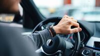 An Unrecognizable Businessman Driving His Car